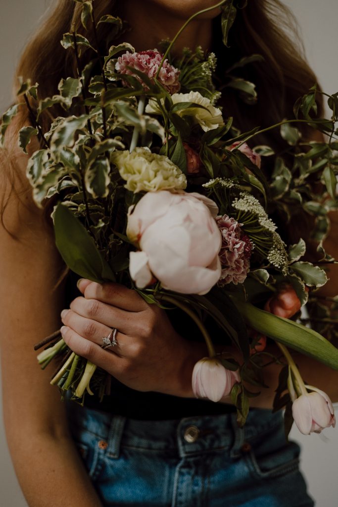 a person holding a bouquet of flowers